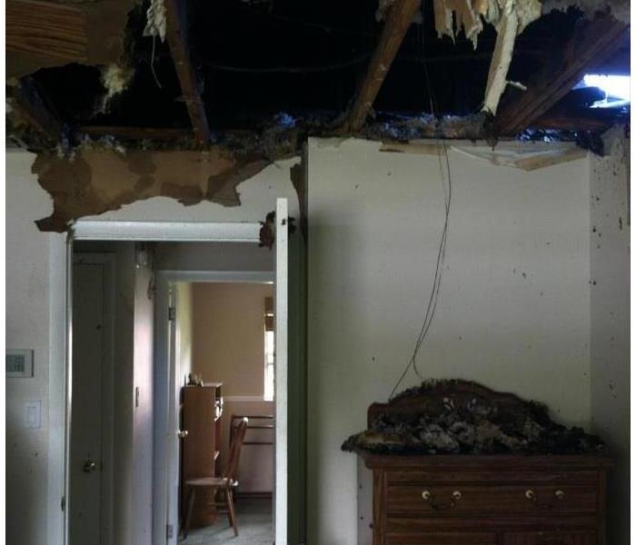 Master bedroom destroyed after fire and water damage