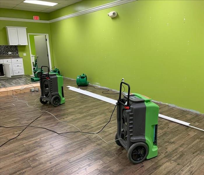 Water damage on the floor of a Polk County office