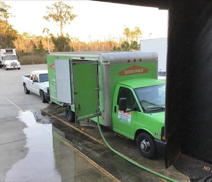 SERVPRO truck responding to a warehouse flood in Polk County